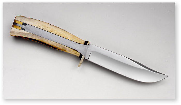 Morseth blade with handle in half showing the full tang and nut on butt end
